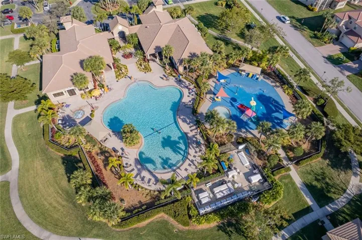 Aerial perspective of suburban area with a pool area