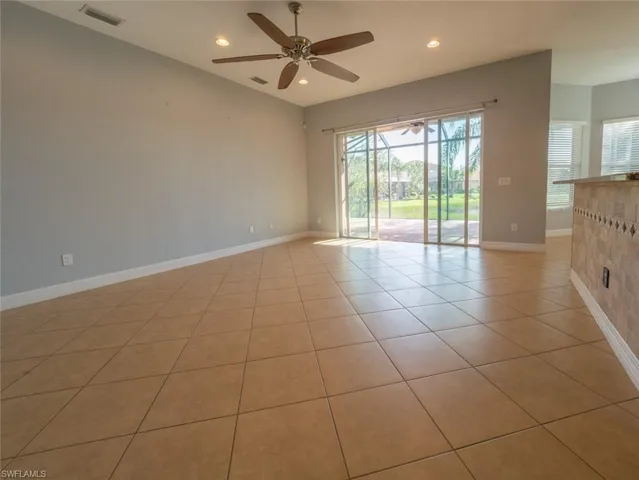 Unfurnished room with light tile patterned floors, recessed lighting, and a ceiling fan