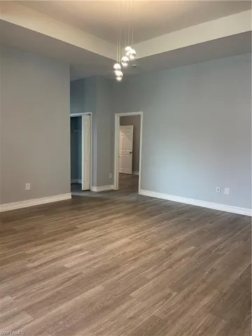 Empty room with wood finished floors and baseboards