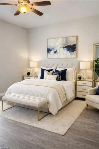 Bedroom with wood finished floors and a ceiling fan