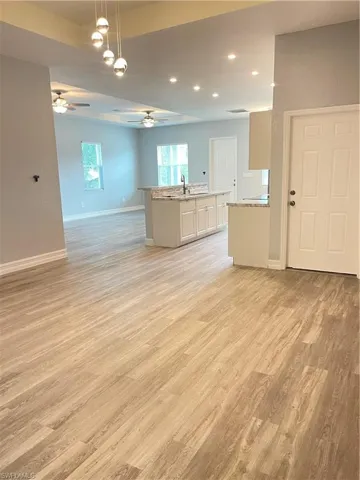 Unfurnished room with light wood-style floors and recessed lighting