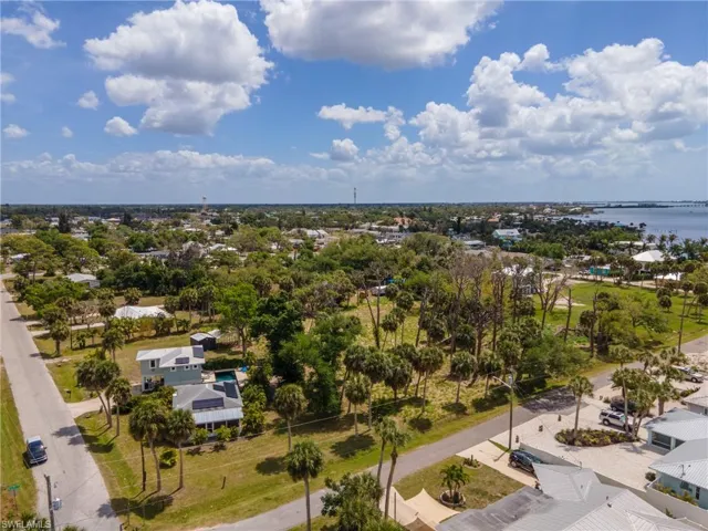 Aerial perspective showcasing a residential area with lush vegetation