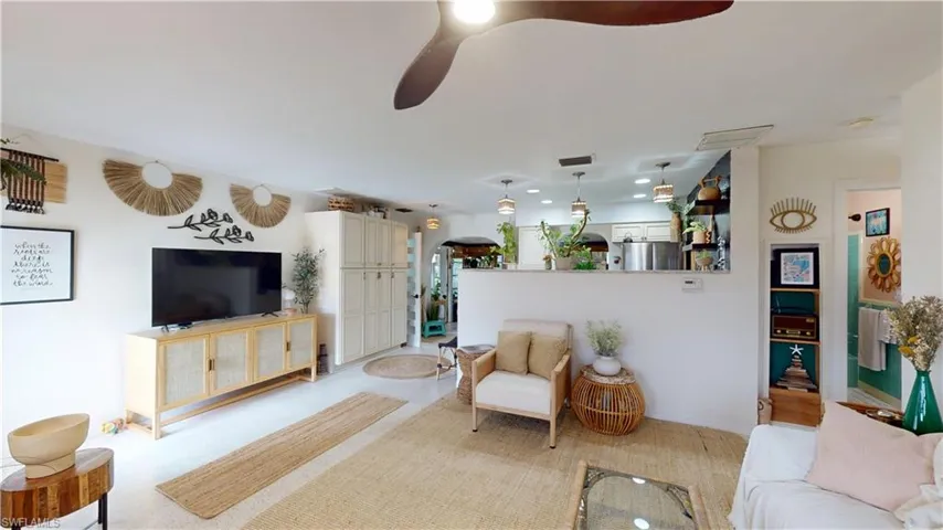 Living room featuring ceiling fan