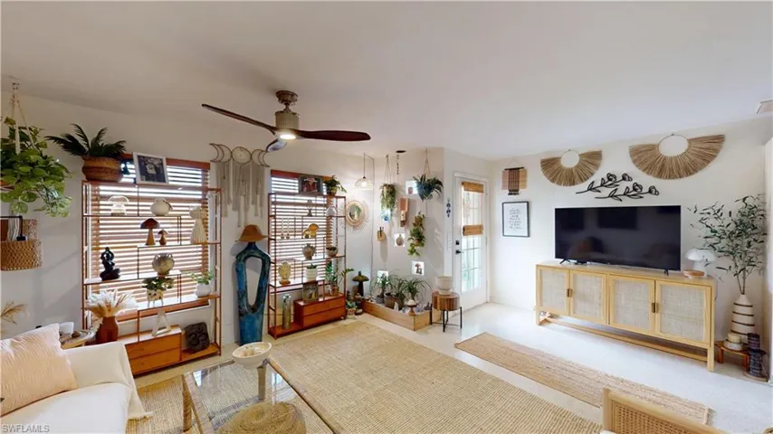Living room featuring ceiling fan