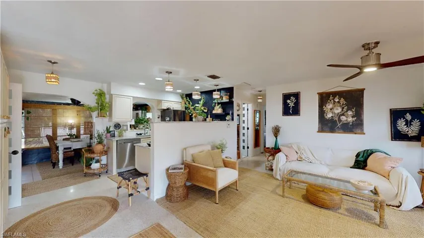 Tiled living room featuring ceiling fan