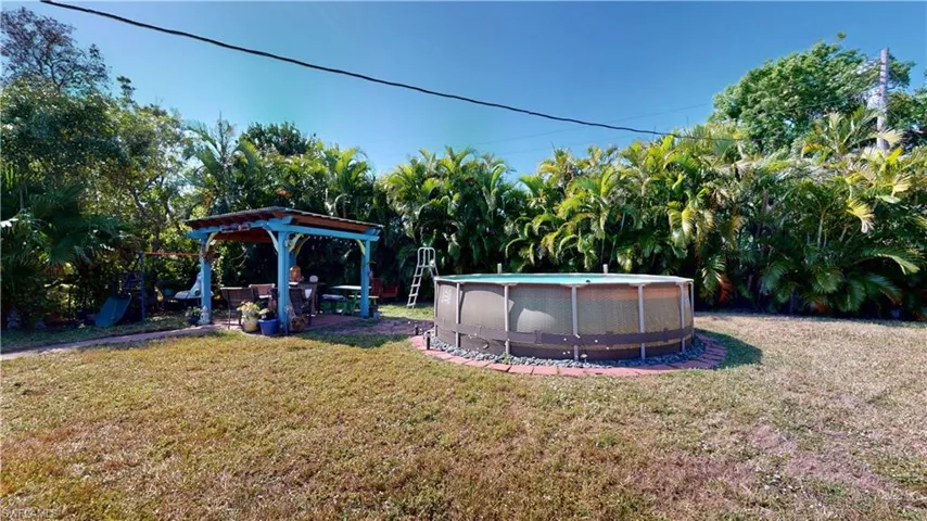 View of yard featuring cooling unit and a gazebo