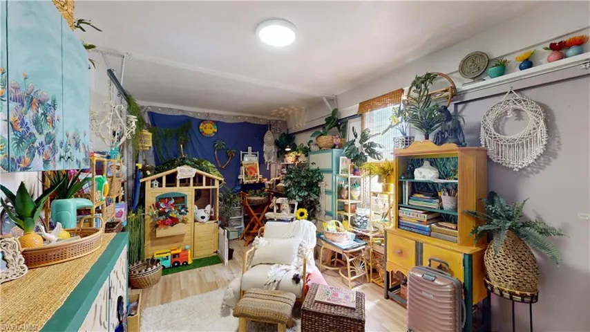 Misc room with wood-style flooring