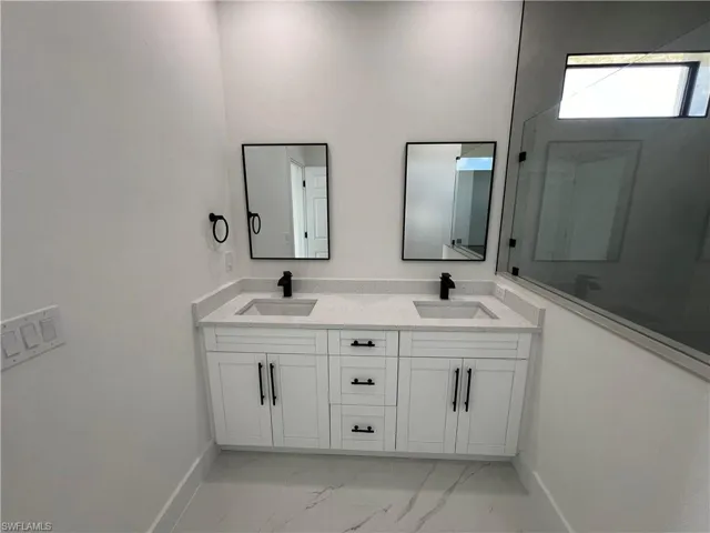 Bathroom featuring vanity and tile patterned floors