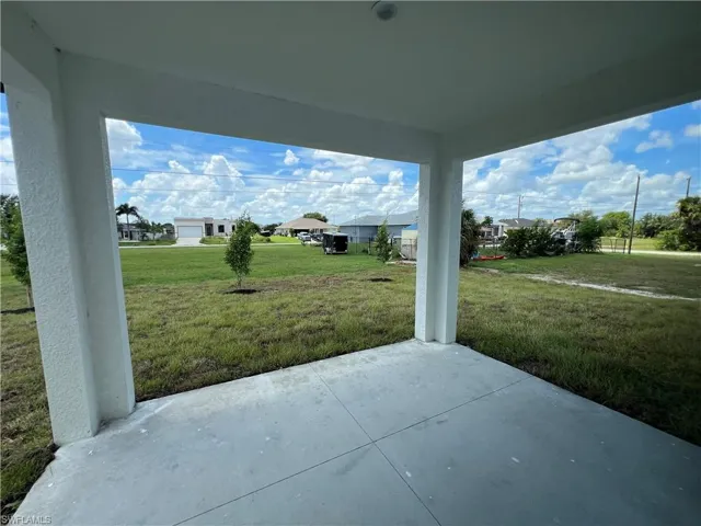 View of patio / terrace featuring a garage