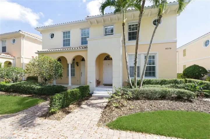 Mediterranean / spanish-style home featuring a porch and stucco siding