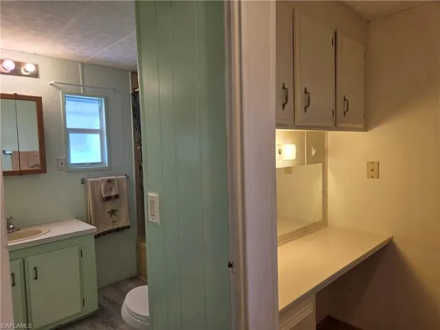 Hall bathroom and planning desk in the hallway.
