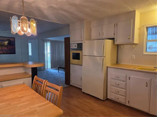 All appliances convey. View from your kitchen past the breakfast bar into your living room.