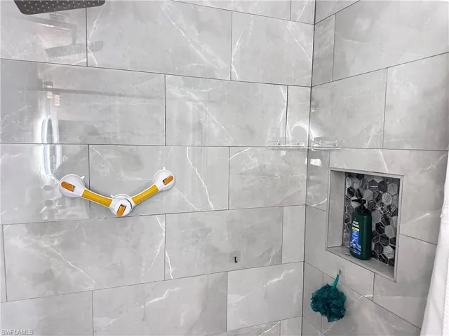 Bathroom view of a tile shower