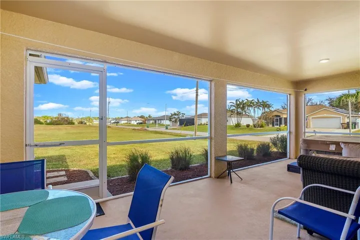 Sunroom / solarium featuring a residential view and plenty of natural light