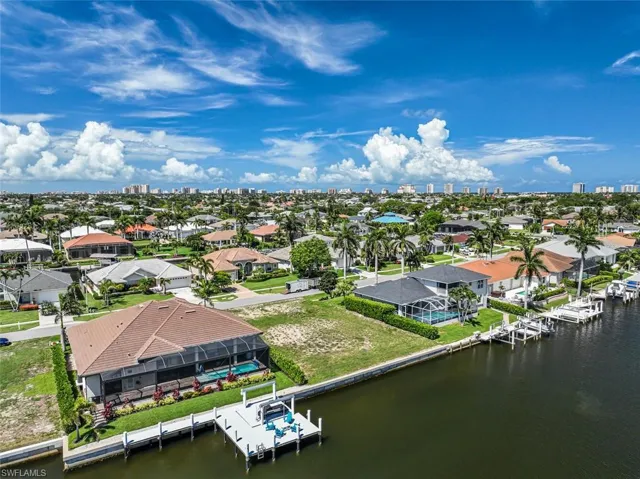 Aerial view of residential area with a nearby body of water