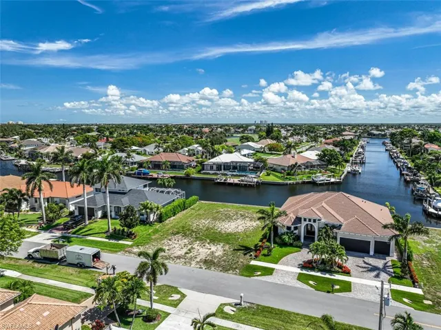 Aerial view of residential area featuring a large body of water