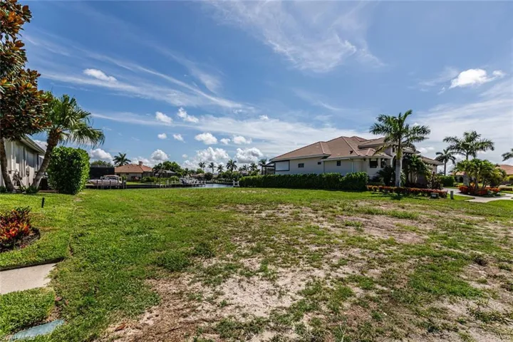 View of yard with a water view
