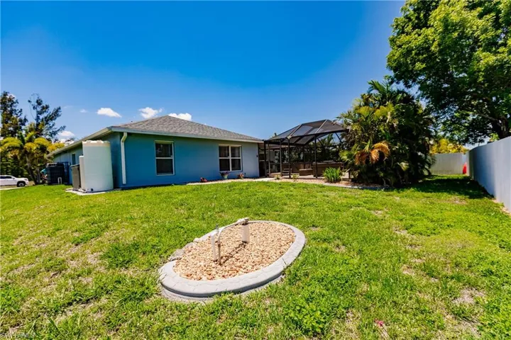 View of yard with a lanai