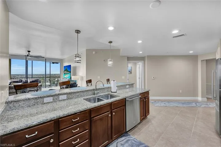 The wide-set island gives plenty of space between the sink and range.