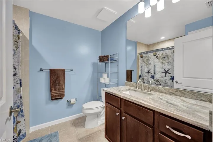 Large guest bath with new granite and new sink faucet. A linen closet provides extra storage!