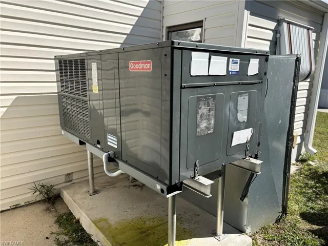 Exterior view of pet washing station and a central air condition unit