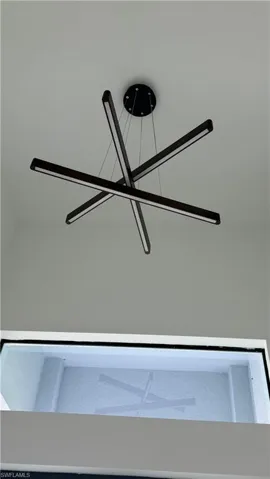 Contemporary multi-arm chandelier with integrated linear LED lighting