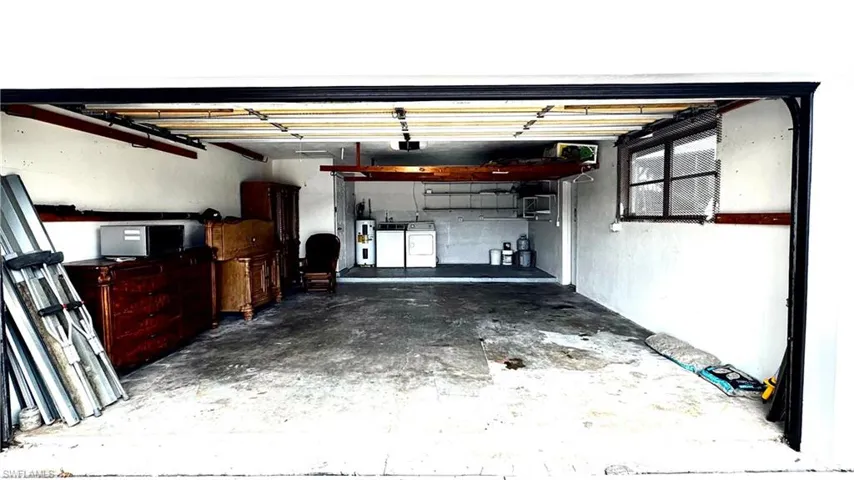 2 car garage with room for storage.  Metal shutters