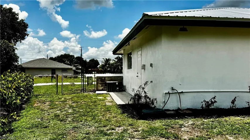 Right side where AC is located and it is gated