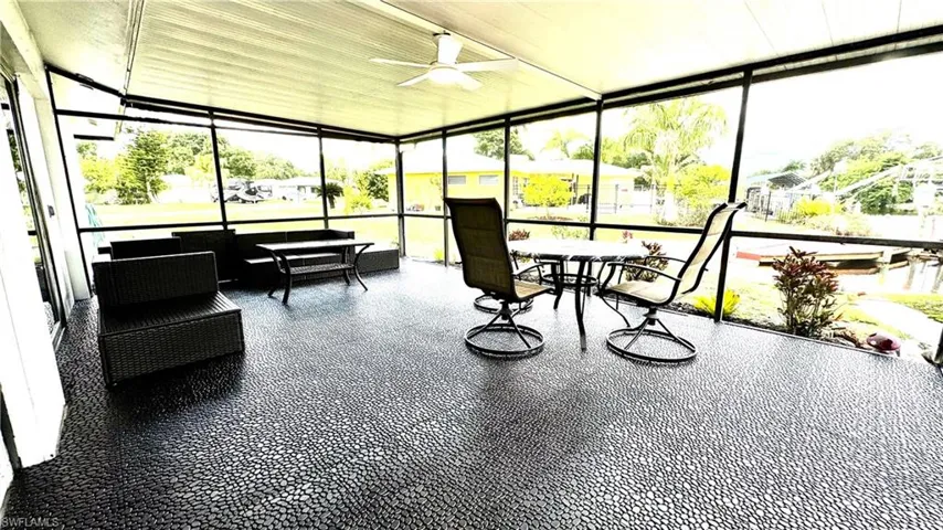 Brand new rubber tile flooring and new fan with light in lanai