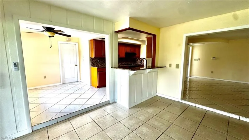 View from family room into the kitchen and dining area