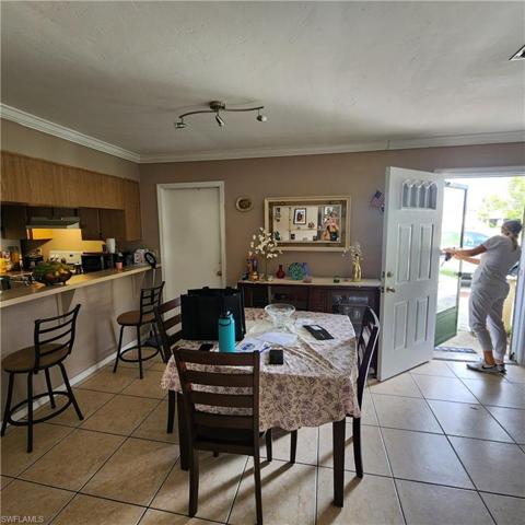 1512 Dining Area looking at front door on right and door to Garage on left