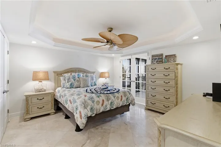 Primary Bedroom with beautiful cermamic tile and airy feeling of sunshine. Photo may be digitally enhanced.