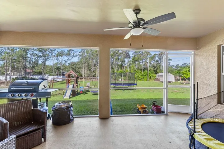 Sunroom / solarium with ceiling fan and a healthy amount of sunlight