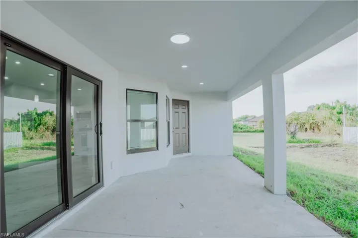 Spare room featuring marble tiled flooring, recessed lighting, lofted ceiling, and ceiling fan