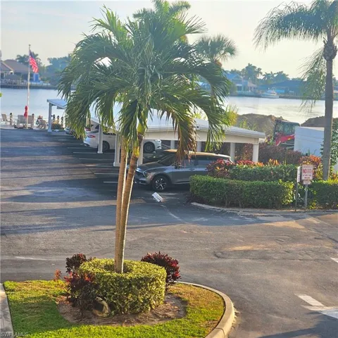 View of asphalt road featuring a water view