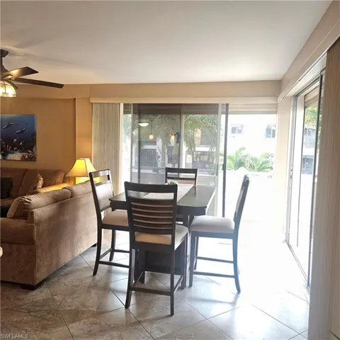 Dining area featuring light tile patterned floors