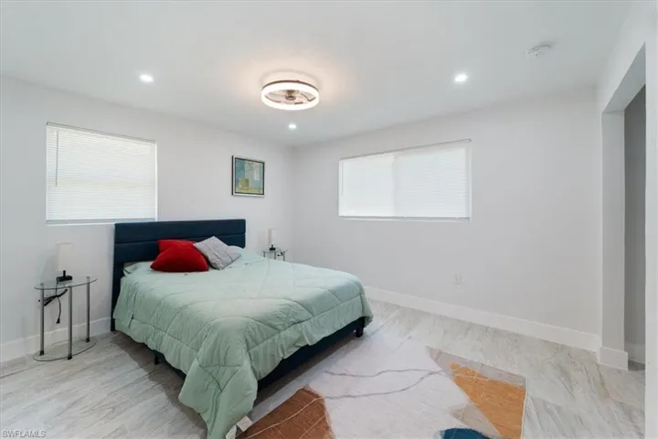 Bedroom featuring recessed lighting and baseboards
