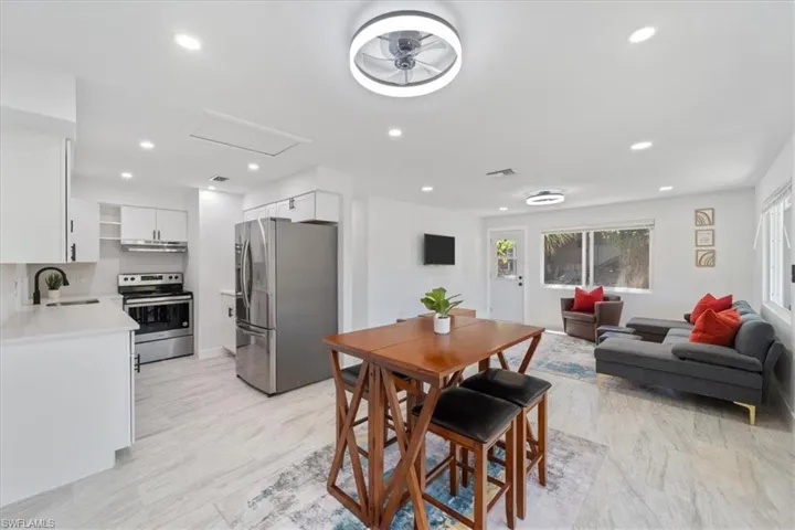 Dining room with attic access, visible vents, and recessed lighting