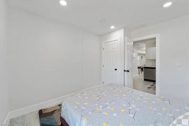 Bedroom with baseboards and recessed lighting