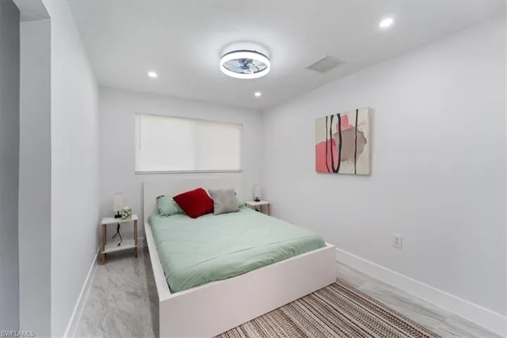 Bedroom with recessed lighting, visible vents, and baseboards