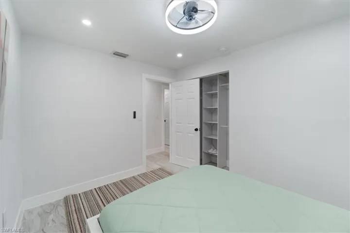 Bedroom featuring recessed lighting, a closet, visible vents, and baseboards
