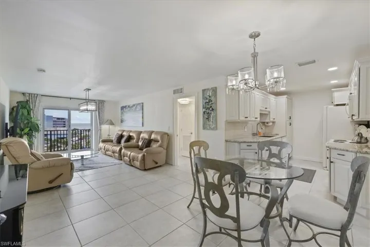 Dining space with a chandelier and light tile patterned floors