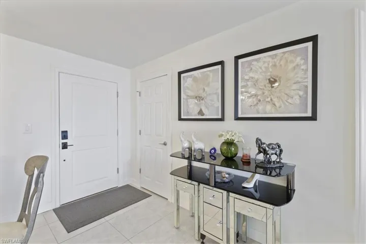 Foyer with light tile patterned floors