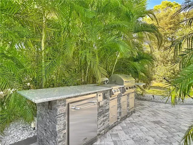 View of patio / terrace featuring exterior kitchen