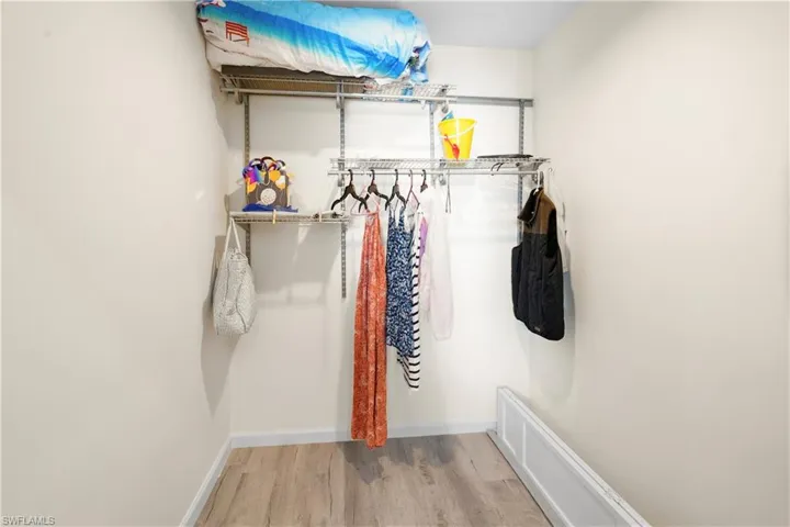 Spacious closet with wood finished floors