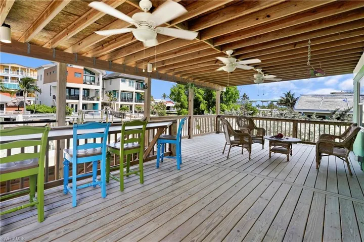 Wooden deck with a ceiling fan