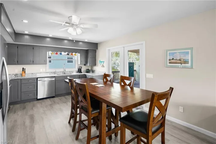 Dining area with light wood finished floors, ceiling fan, recessed lighting, and baseboards