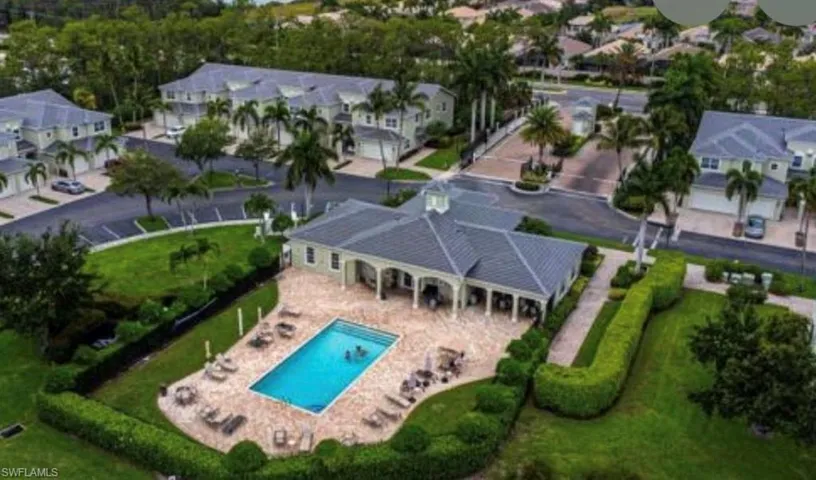 View of property location featuring nearby suburban area and a pool