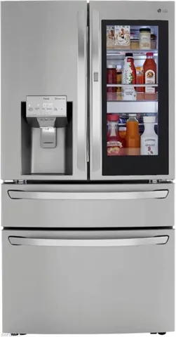 Kitchen view of stainless steel fridge with ice dispenser