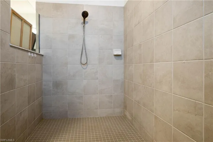 Full bathroom featuring a tile shower